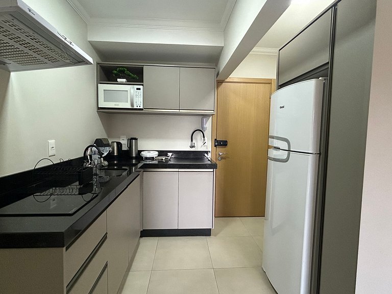 Apto Moderno com garagem passos da Vila Germânica